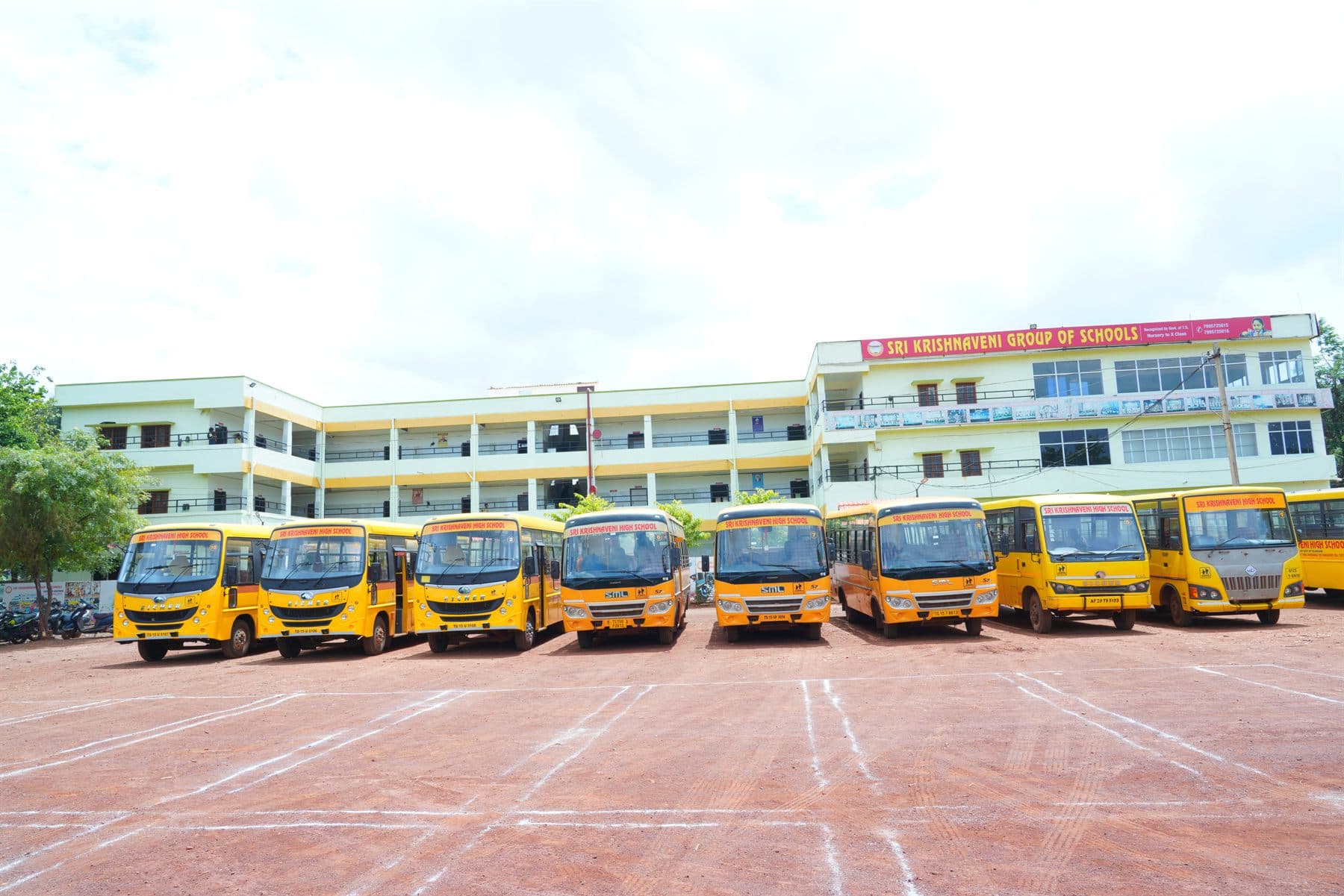Sri Krishnaveni school buses lined up in front of the campus